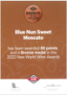 Bottle of Blue Nun Sweet Moscato 750ml, featuring a light yellow label and subtle bubbles in the wine, along with a Bronze medal seal.